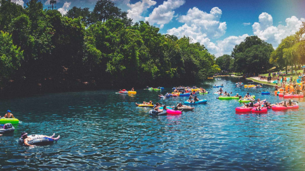 Tubers floating the spring-fed Comal River in New Braunfels during summer