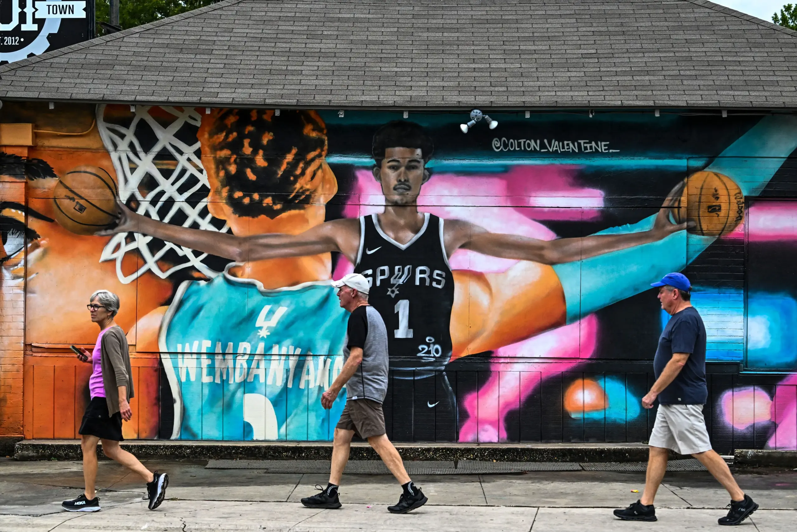 Southtown San Antonio real estate neighborhood: Victor Wembanyama Spurs mural with pedestrians walking past