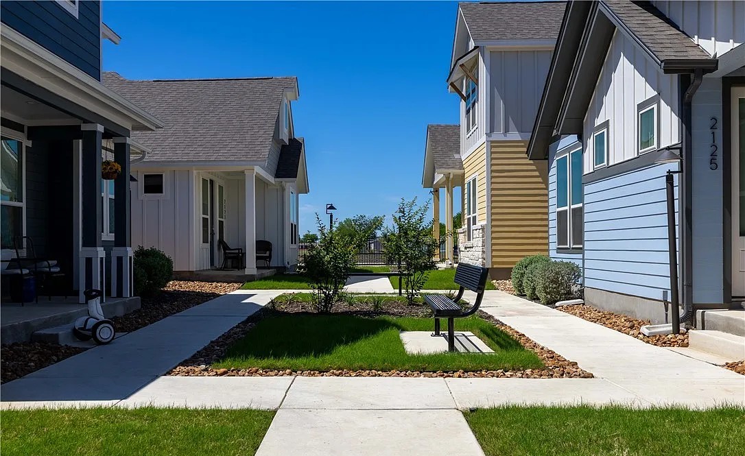 Cottage homes facing a landscaped courtyard in New Braunfels, Texas