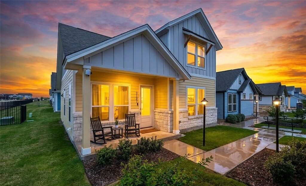 Cottage style homes in 2026: a painted cottage exterior with a covered front porch at Garten Haus in New Braunfels, Texas