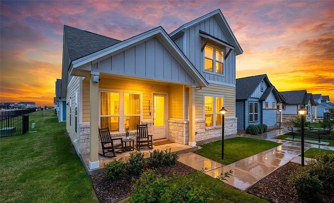 Cottage style homes in 2026: a painted cottage exterior with a covered front porch at Garten Haus in New Braunfels, Texas